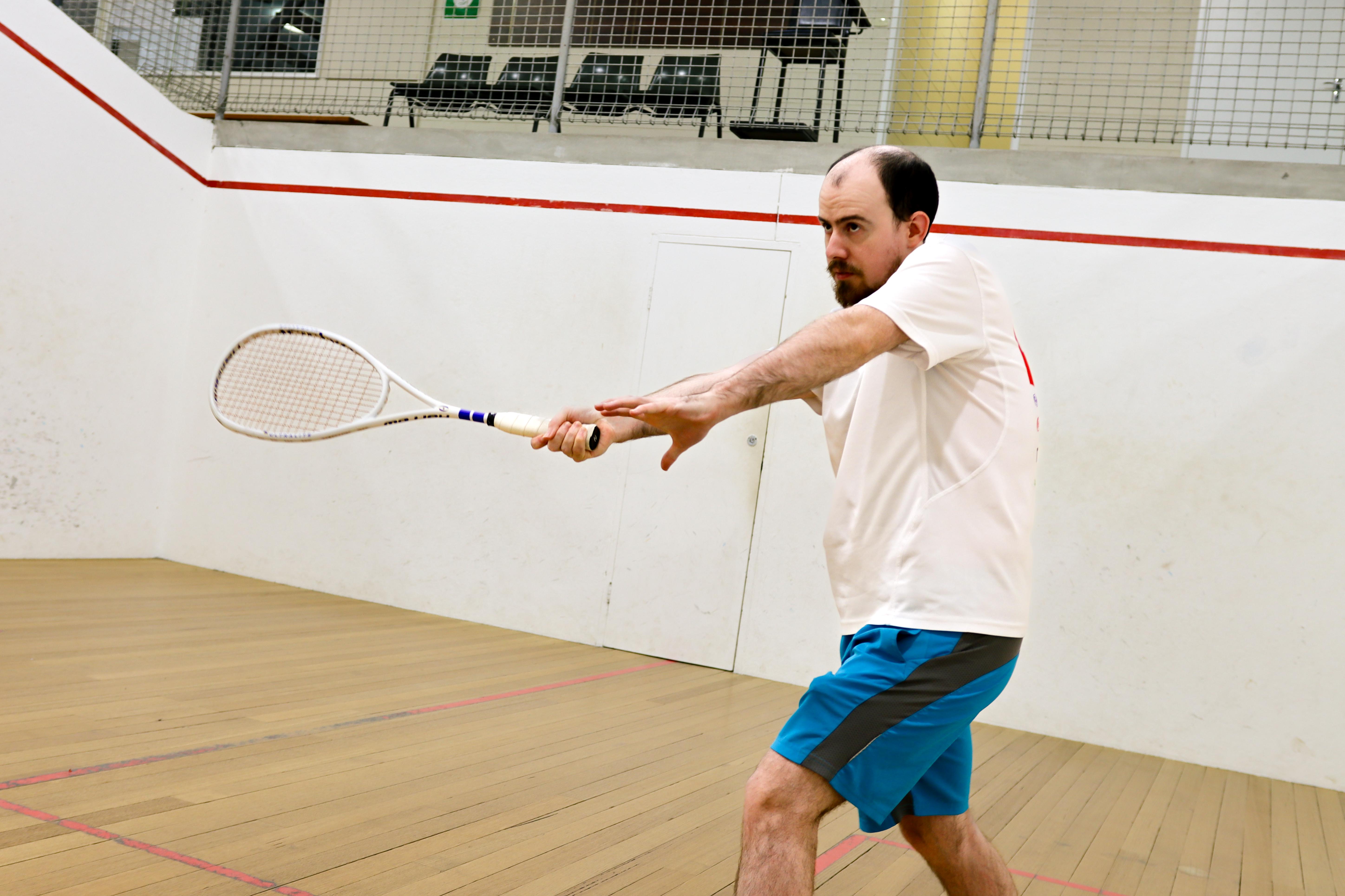 Squash player lining up a shot